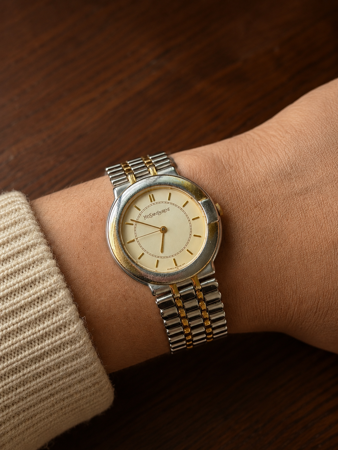Vintage Yves Saint Laurent gold dial quartz watch, front view