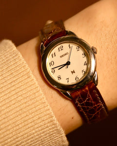 Seiko Noie 1F21-0050 vintage gold-tone round quartz watch thumbnail 1