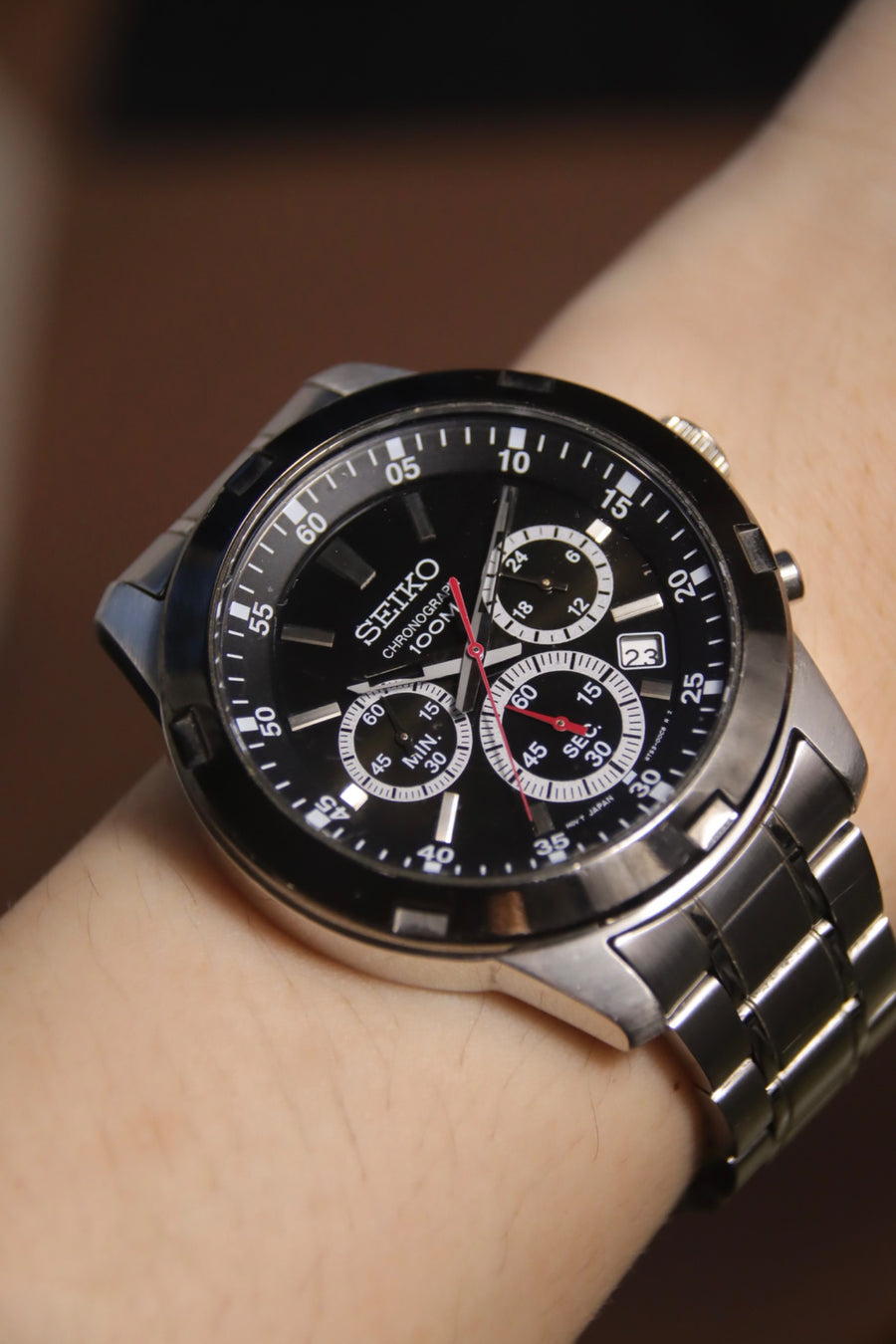 Seiko Chronograph 100M black dial stainless steel quartz vintage watch on wrist